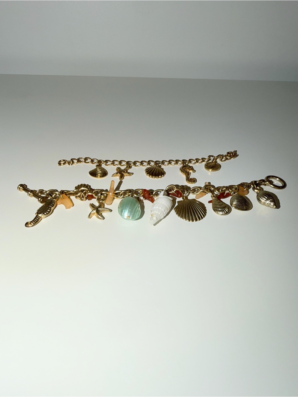 Two Charmed Gold-Tone Seashell Charm Bracelets